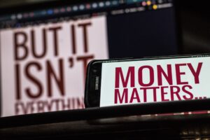 Smartphone showing financial news alerts during market volatility