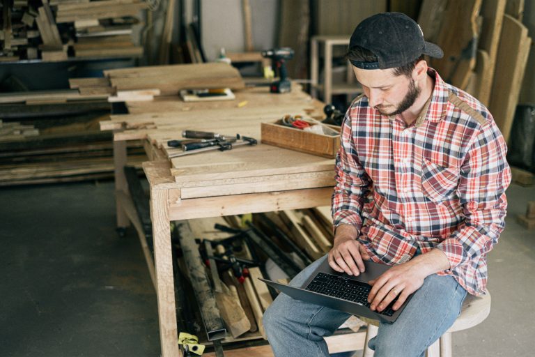 A small business owner reviewing financial data on a laptop