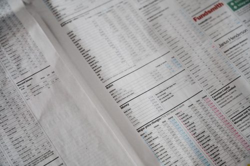 hands reviewing banking consolidation papers