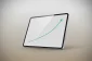 Tablet on neutral background showing a clean rising line chart, conveying a trusted retirement-planning resource.